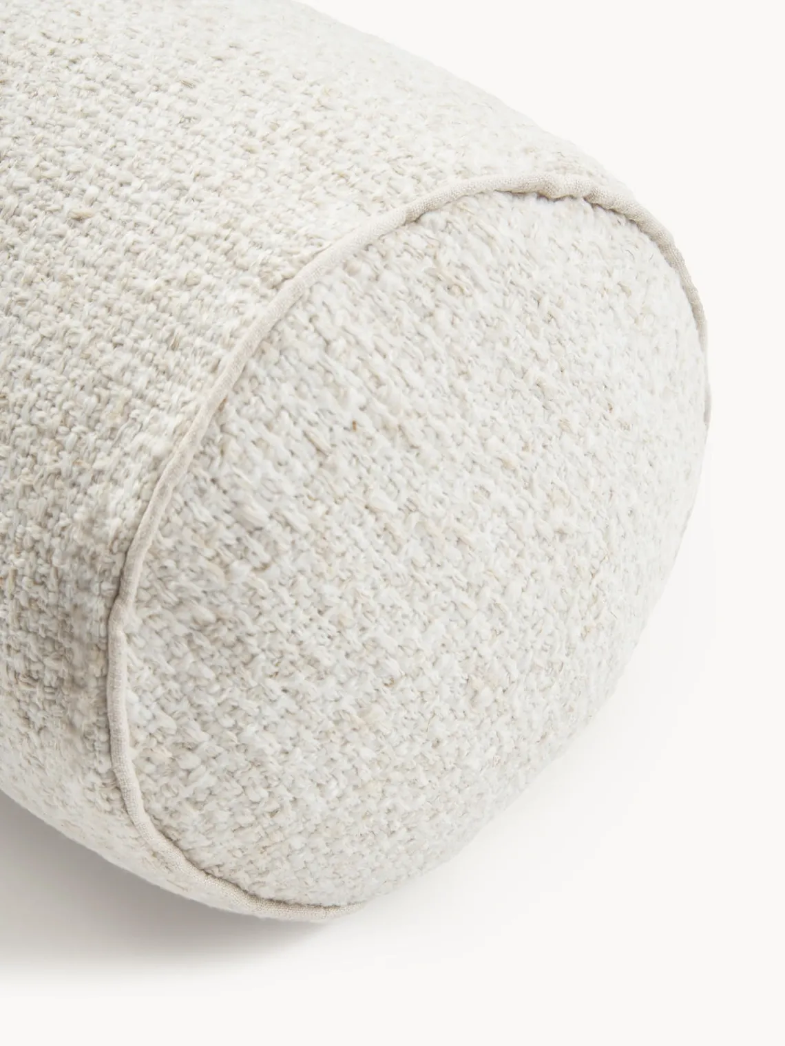 Cojín rulo en tejido bouclé con ribete Aya Mantas|Cojines Decorativos