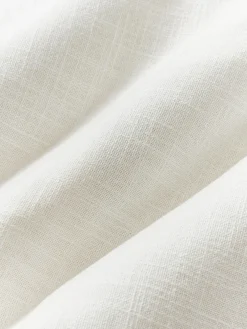 Funda de cojín artesanal con relieves Coraline Mantas|Cojines Decorativos