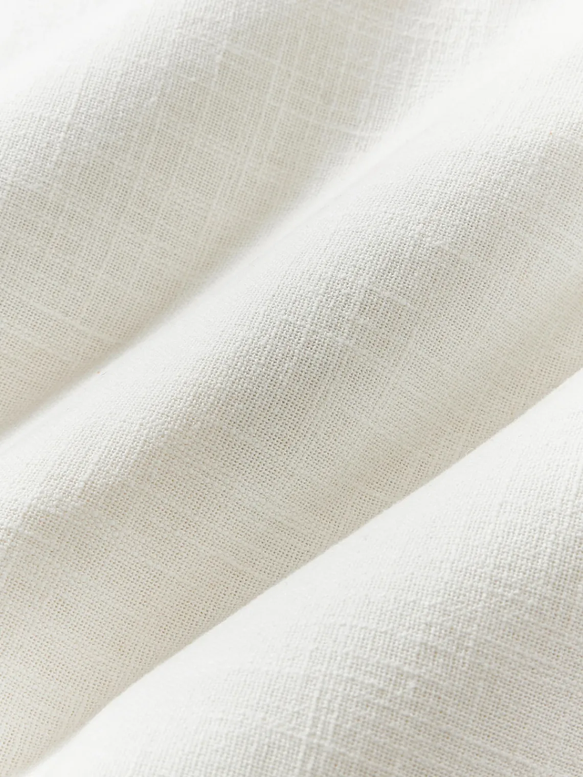 Funda de cojín artesanal con relieves Coraline Mantas|Cojines Decorativos